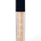 A clear rectangular tube of concealer with a black cap, showing a shimmering champagne-beige formula inside. The tube has 'Face Me Beauty' printed in white script on the front, set against a plain white background.