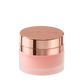 A frosted glass cosmetic jar with a metallic rose gold lid, featuring the brand name Face Me Beauty COSMETICS' embossed on top, set against a plain white background.