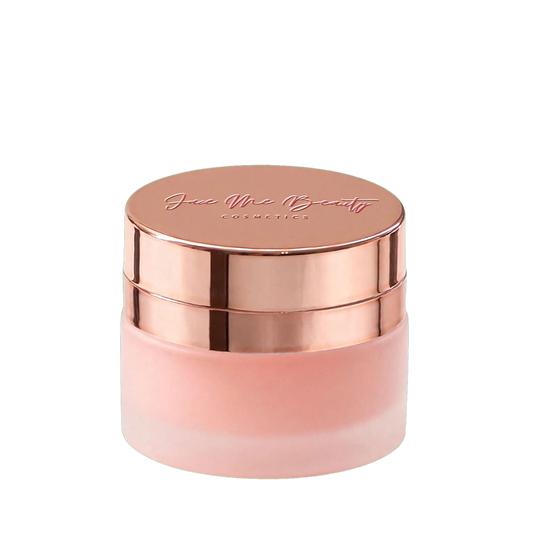 A frosted glass cosmetic jar with a metallic rose gold lid, featuring the brand name Face Me Beauty COSMETICS' embossed on top, set against a plain white background.